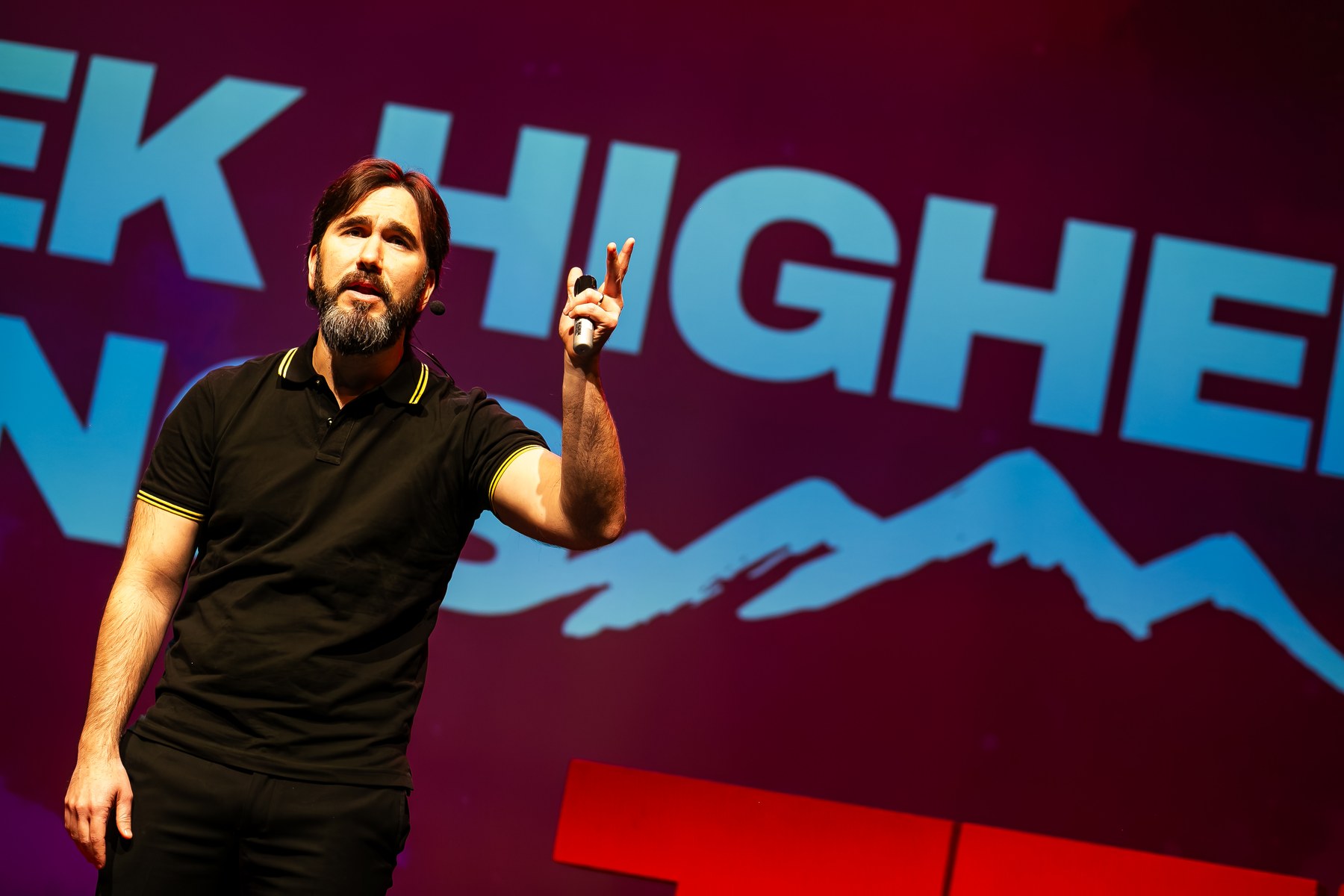 Jose Ucar presenting on stage at TEDx University of Salford